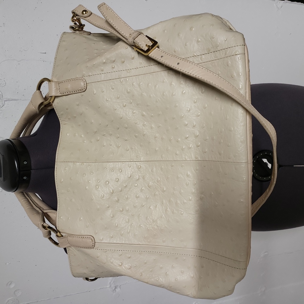 GILI 100% leather outer, cotton polyester lining. Never used.